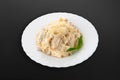 Tagliatelle pasta, cream, chicken fillet, mushrooms, Bulgarian pepper, mazzarella cheese, parmesan cheese On a white plate. Dark Royalty Free Stock Photo