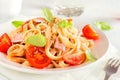 Tagliatelle pasta with ham and tomatoes Royalty Free Stock Photo