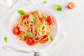Tagliatelle pasta with ham and tomatoes Royalty Free Stock Photo