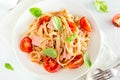 Tagliatelle pasta with ham and tomatoes Royalty Free Stock Photo