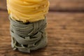 Tagliatelle pasta on wooden surface Royalty Free Stock Photo