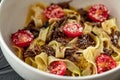 Tagliatelle with stewed veal with truffle paste, cheri and parmesan. Pasta with veal