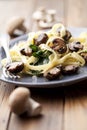 Tagliatelles with spinach and mushrooms Royalty Free Stock Photo