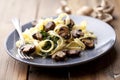 Tagliatelles with spinach and mushrooms Royalty Free Stock Photo