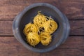 Taglierini pasta on a pottery pan Royalty Free Stock Photo