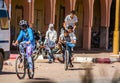 Tagounite, Morocco - October 10, 2013. Life on the street - three children riding on one bike