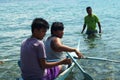 young people enjoy riding on tiny small boat on sea Royalty Free Stock Photo