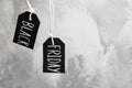 Tags with words BLACK FRIDAY hanging on grey background. Space for text Royalty Free Stock Photo