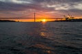 Tagus River, Bridge April 25 Lisbon at sunset from ship, Portugal. Royalty Free Stock Photo