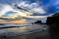 Tahah Lot Temple and ocean waves at sunset, Bali Royalty Free Stock Photo