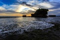 Tahah Lot Temple and ocean waves at sunset, Bali Royalty Free Stock Photo