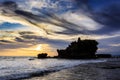 Tahah Lot Temple and ocean waves at sunset, Bali Royalty Free Stock Photo