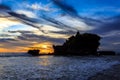 Tahah Lot Temple and ocean waves at sunset, Bali Royalty Free Stock Photo