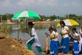 School children getting down from the boat and attending school. Local transportation