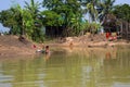 Women from the rural village washing their daily utensils and clothes using river water. Unhygienic usage of water