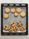 Tahini cookies on a baking sheet. Copy space in the center for your text