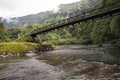 Tahiti. The bridge through the river in mountains.