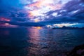 Tahitian sunset featuring several vessels sailing along the tranquil surface of the ocean Royalty Free Stock Photo