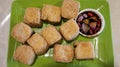 Tahu Goreng Sumedang is Indonesian street snack from West Java. Crispy deep fried tofu served with mix of soy sauce, onion, and Royalty Free Stock Photo