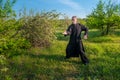 Tai chi chuan master practiing in a wild garden Royalty Free Stock Photo