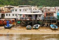 Tai O fishing village, Lantau Island. Primitive sheet metal houses stand on stilts to which fishing boats are moored. A popular Royalty Free Stock Photo