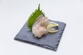 Tai Sashimi : Sliced Raw Tai Red Seabeam Fish Served with Sliced Radish on Stone Plate