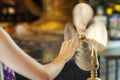 Worshipper at Che Kung Temple, Tai Wai, spinning a brass wheel o