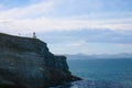 Taiaroa Head is a headland at the end of the Otago Peninsula in New Zealand, overlooking the mouth of the Otago Harbour. The cape