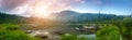 Taiga. Lake and mountains at dawn with beautiful clouds. Panorama. Royalty Free Stock Photo