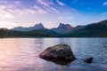 Taiga. Lake and mountains at dawn with beautiful clouds. Royalty Free Stock Photo