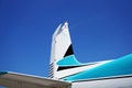 Tail of an Airplane against the Blue Sky Royalty Free Stock Photo