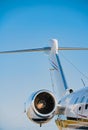 Tail fin, fuselage and jet engine of a small business jet Royalty Free Stock Photo