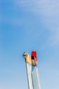 Tail fin, rudder and beacon lights, small single engine airplane with old paint and bright blue sky. Royalty Free Stock Photo