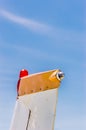 Tail fin, rudder and beacon lights, small single engine airplane with old paint and bright blue sky. Royalty Free Stock Photo