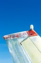 Tail fin, rudder and beacon lights, small single engine airplane with old paint and bright blue sky. Royalty Free Stock Photo