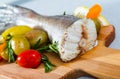 Tail of hake by rustically frying and served with boiled potatoes and tomatoes