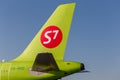 Tail of passenger jet of S7 Airlines. Airplane fuselage. Aviation and transportation Royalty Free Stock Photo