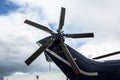 Tail rotor of a helicopter against a blue sky Royalty Free Stock Photo