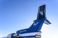 Tail of a short-range three-engine passenger aircraft Yak-42 NATO codification: Clobber and a bird in the sky.