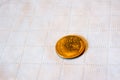 Tail of a 1956 wheat penny on a white tablecloth