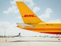 tail of yellow DHL cargo aircraft Royalty Free Stock Photo