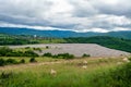 the tailings dumps of a mine between the hills