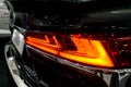 Taillight, headlight of modern prestigious luxurious car. Closeup, macro view of LED xenon car`s headlamp, lamp headlight