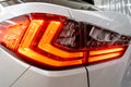 Taillight, headlight of modern prestigious luxurious car. Closeup, macro view of LED xenon car`s headlamp, lamp headlight Royalty Free Stock Photo