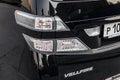 Taillight of Toyota Vellfire japanese luxury minivan car in black color on the parking with seven passenger seats Royalty Free Stock Photo