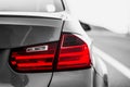 Taillights of a BMW m3 sports car. image black and white, color only taillights Royalty Free Stock Photo