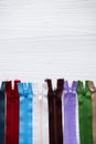 Tailor: colorful and many zipper for tailoring, sewing on wood b