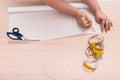 Tailor copies a clothing pattern on tracing paper Royalty Free Stock Photo