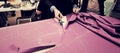 Tailor cutting fabric for bespoke suit