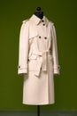 Tailor made designer coat for women on tailor mannequin Royalty Free Stock Photo